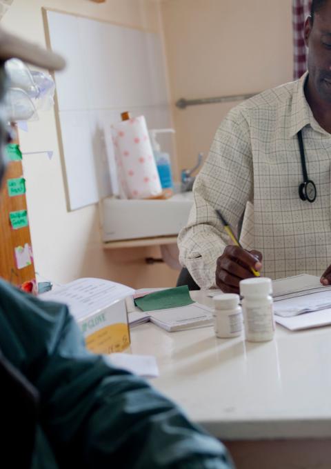 MSF treats more than 200,000 people worldwide for HIV and 97 percent of the antiretrovirals are quality, affordable generics from India. Here, an MSF doctor in Kenya consults one MSF’s thousands of HIV+ patients under treatment. 