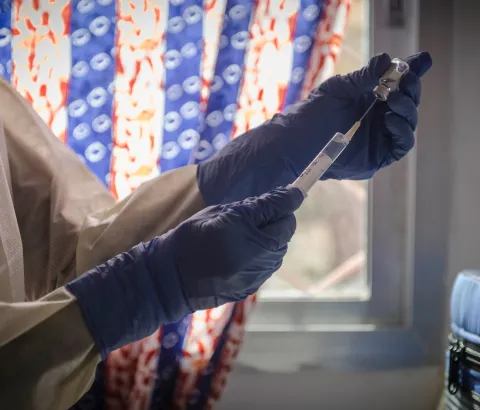 MSF staff prepares a dose of an experimental vaccine